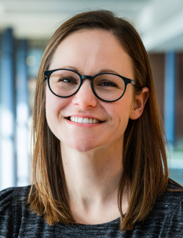 A head-and-shoulders portrait of Janine Kwapis, PhD