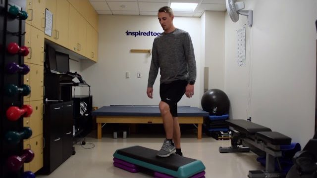 A still from a video shows a person performing the Step-Ups exercise.