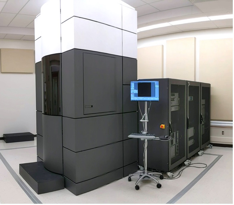 A series of large black boxes containing a Titan Krios cryo-electron microscope.